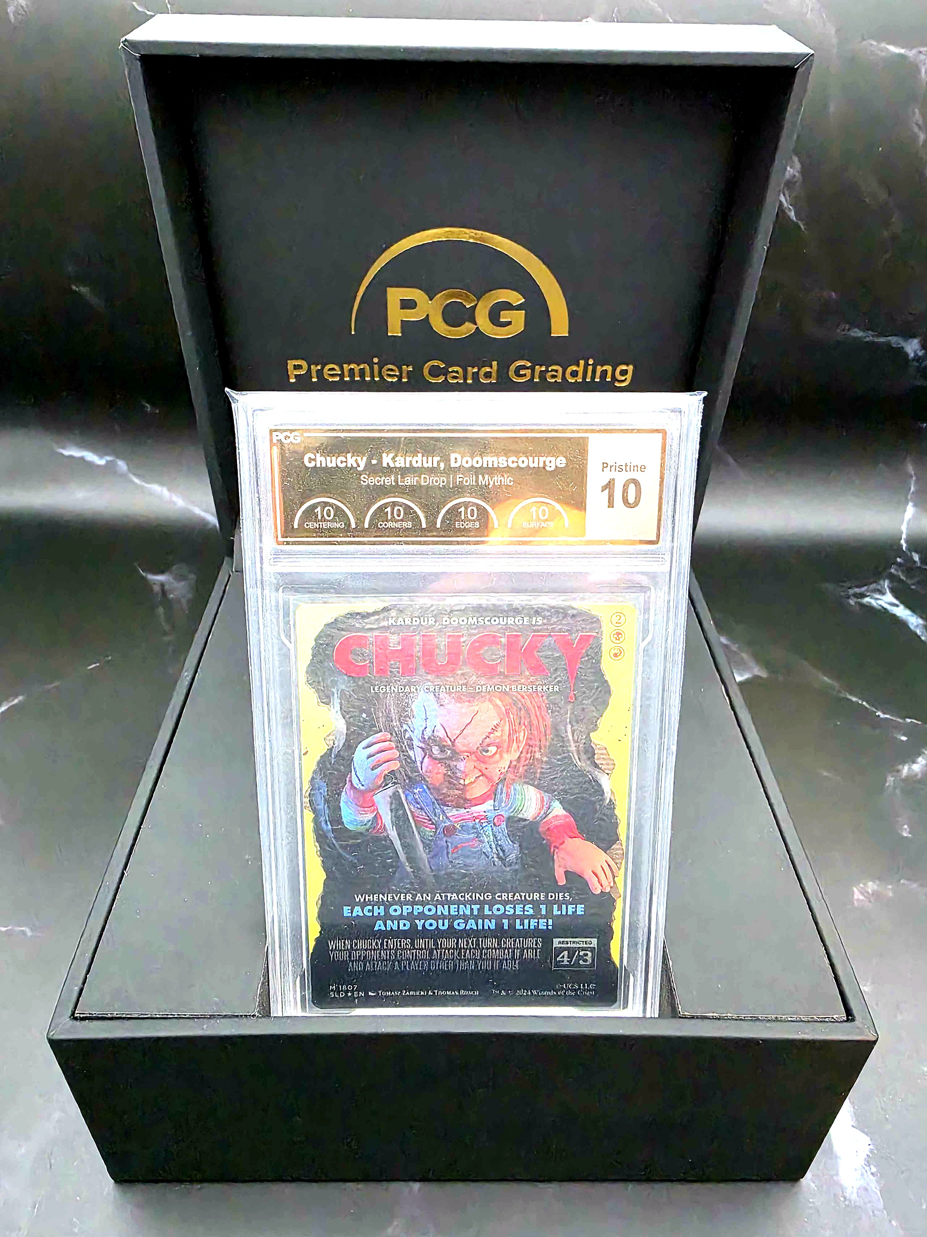 PCG Pristine 10 graded Chucky Secret Lair Magic: The Gathering card in a Premier Card Grading box