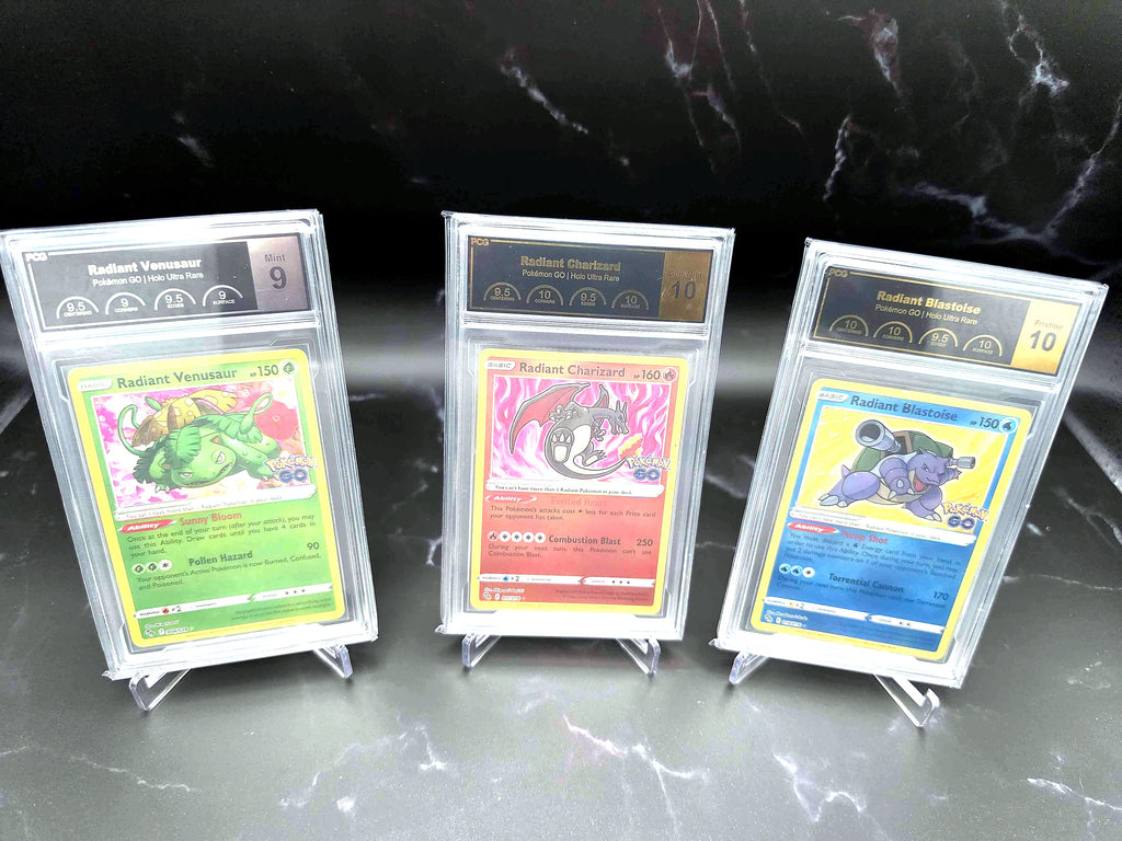 Three PCG-graded Radiant Pokémon GO cards — Venusaur, Charizard and Blastoise